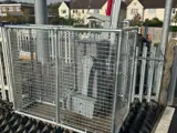 Interclamp key clamp fittings and mesh barrier used to construct a barrier around a level crossing barrier